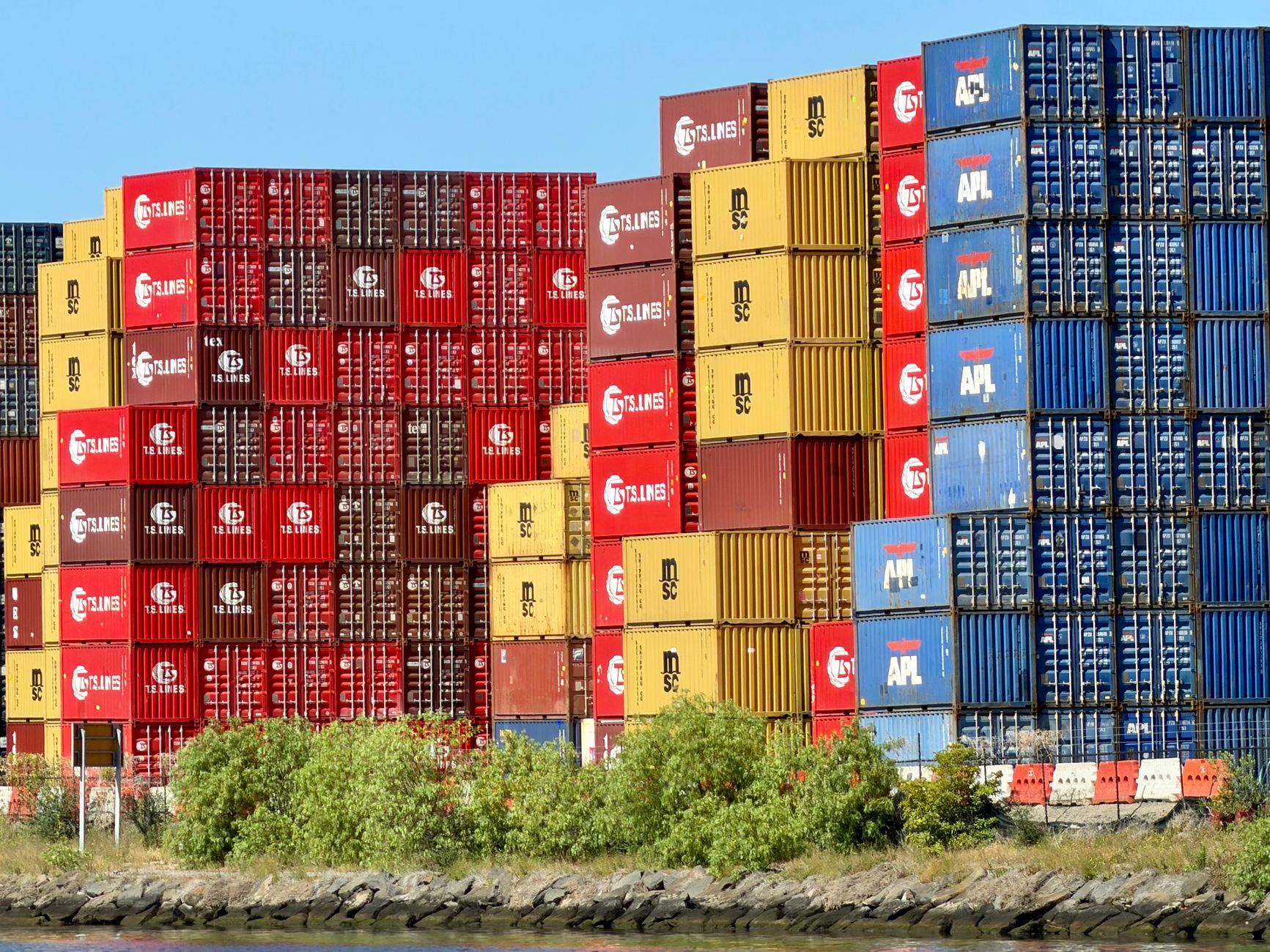 Vibrant shipping containers stacked at West Melbourne port, symbolizing Australian global trade.